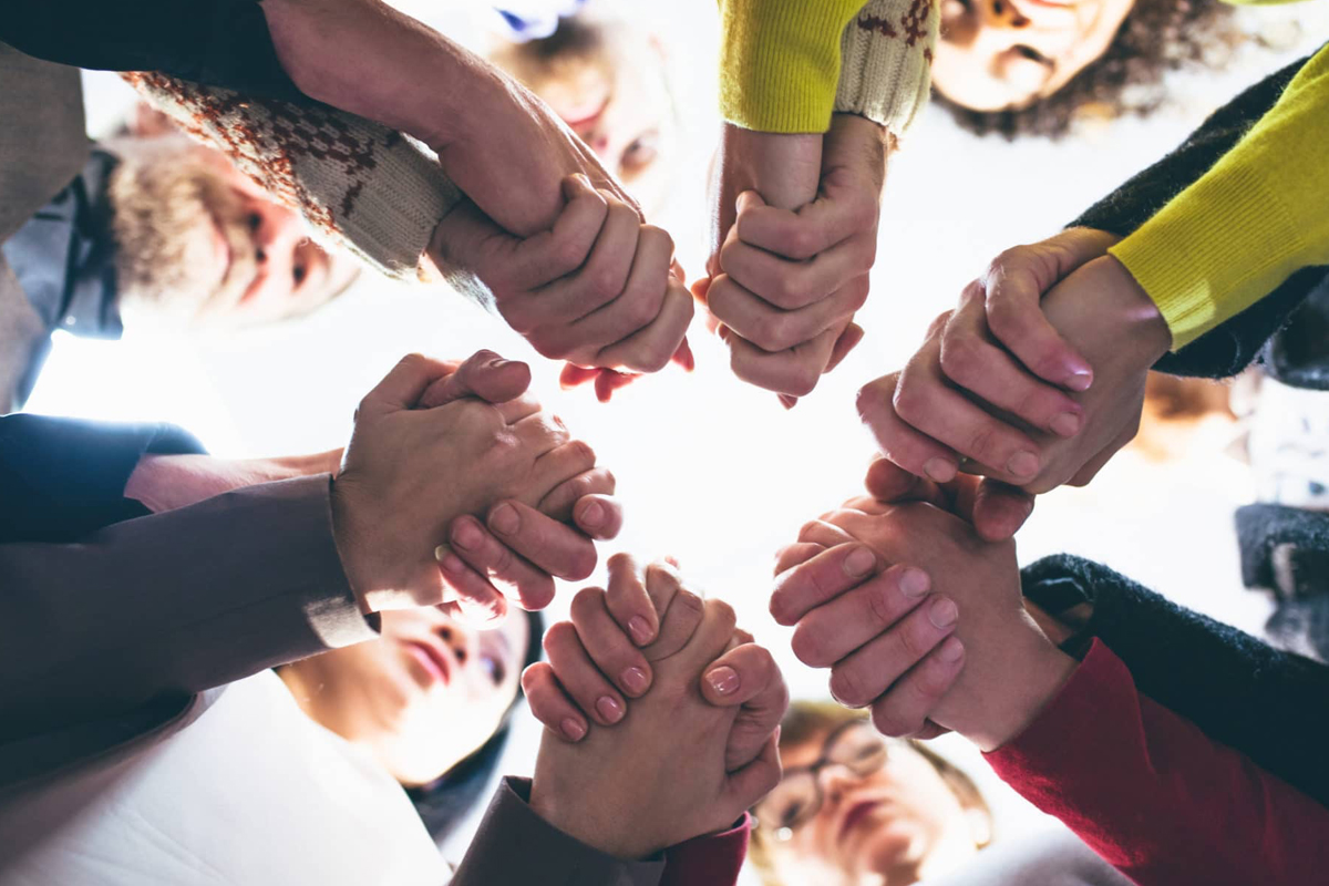 group-of-people-holding-hands