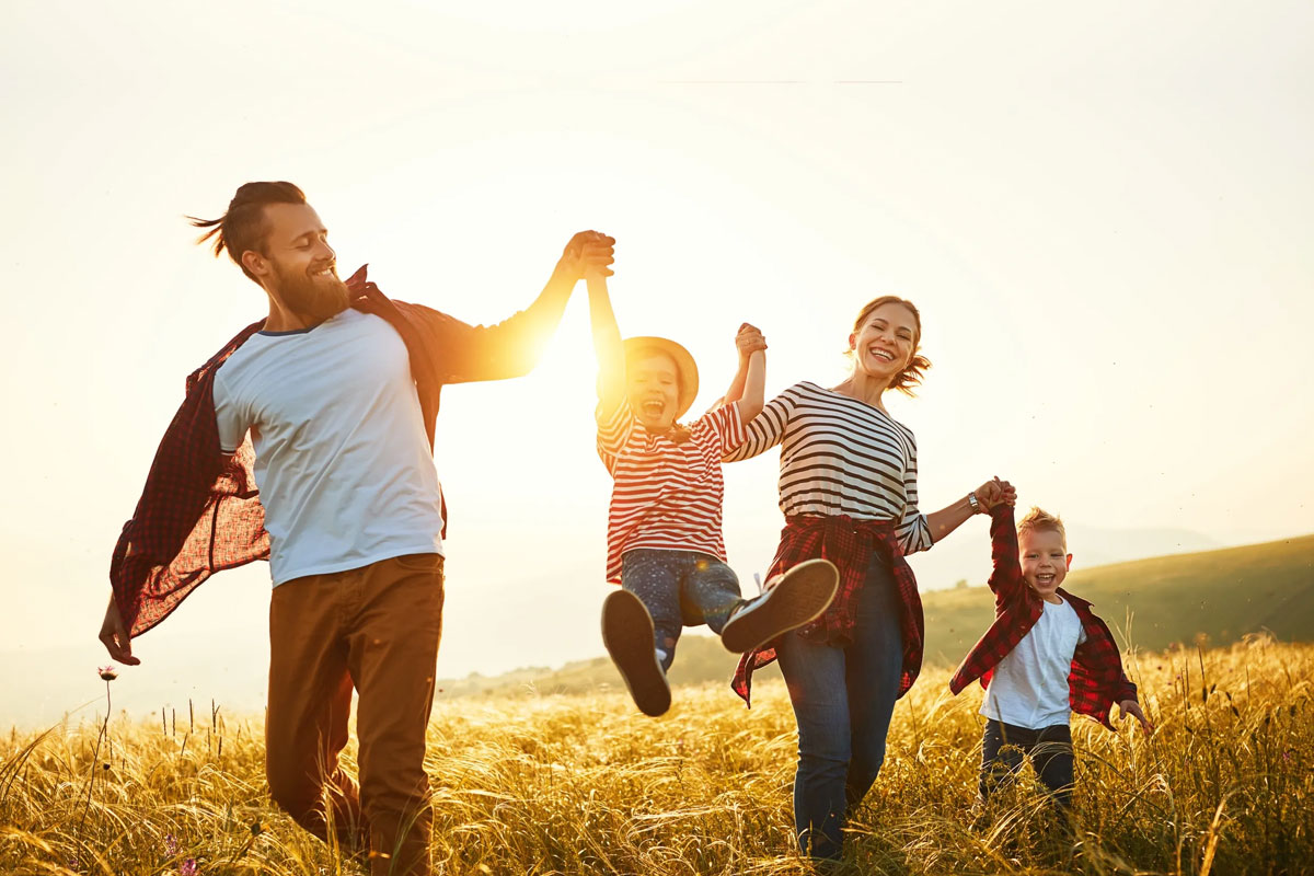 happy-family-playing-in-the-fields